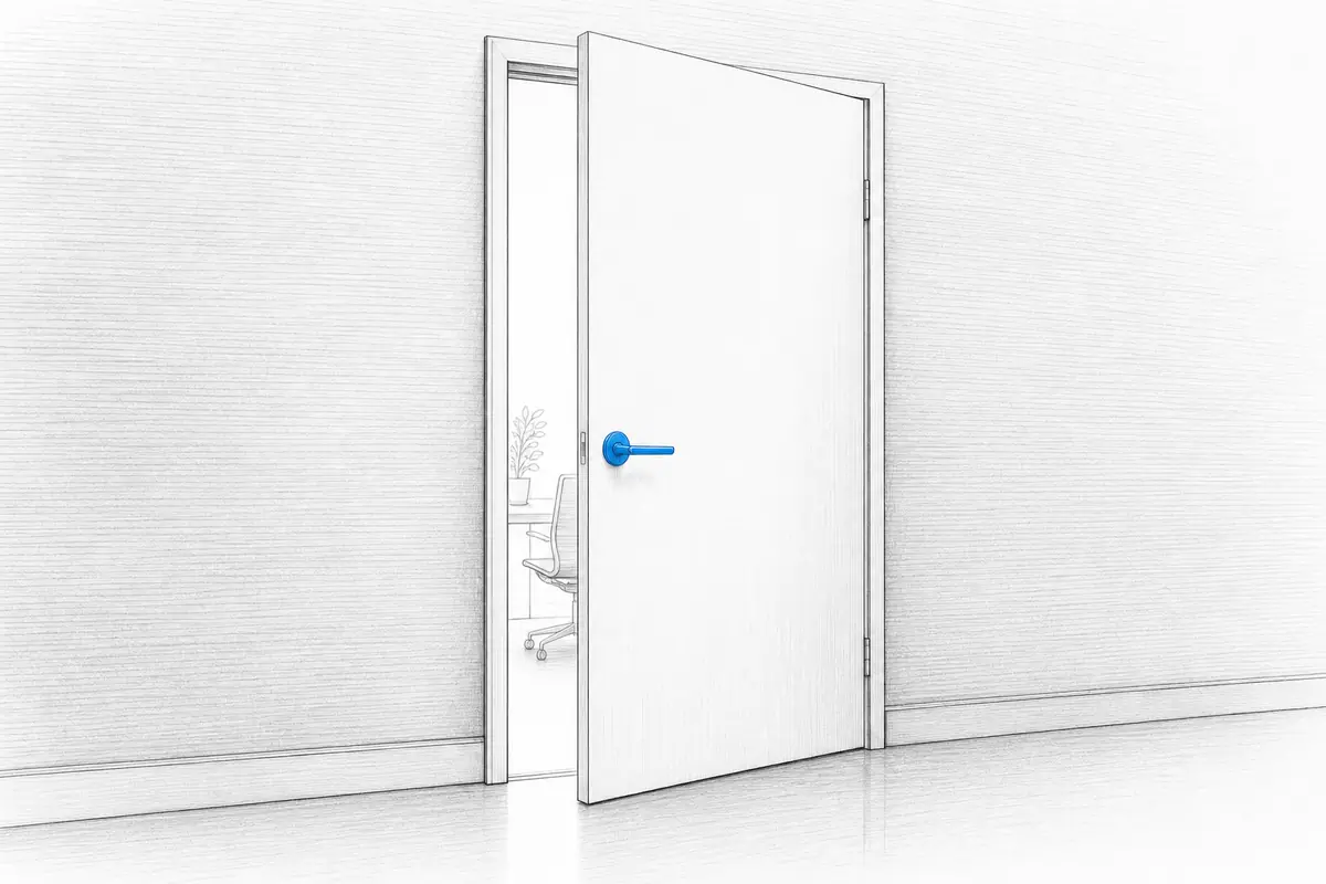 An office door left slightly ajar, light spilling through the gap.